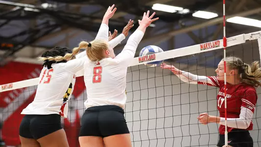 Setter Sydney Dowler (8) and Middle blocker Hannah Thompson (15) block a Wisconsin hit. Maryland Terrapins vs. No. 2 Wisconsin Badgers at The Pavilion in Xfinity Center on Friday, Sept. 24, 2021. Zach Bland/Maryland Terrapins