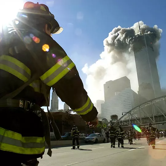 Firefighter runs toward the Twin Towers on Sept. 11, 2001