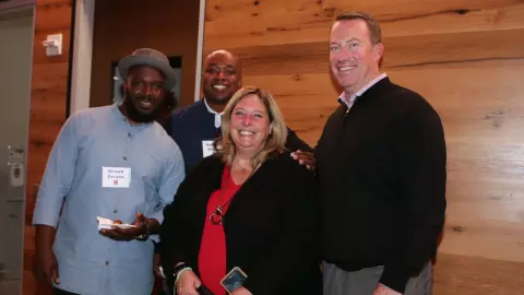 Todd Wike with wife and teammates at 2001 team reunion
