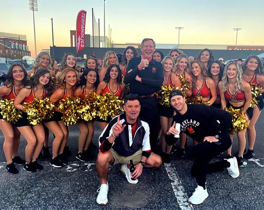 Rick Jaklitsch with cheerleaders