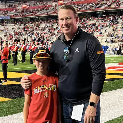 Todd Wike with his oldest son at a Maryland football game
