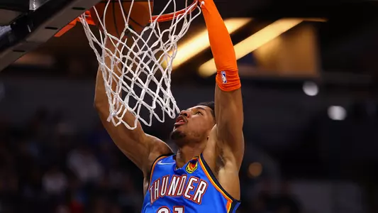 MINNEAPOLIS, MN - JANUARY 05: Aaron Wiggins #21 of the Oklahoma City Thunder dunks the ball during the second quarter against the Minnesota Timberwolves at Target Center on January 5, 2022 in Minneapolis, Minnesota. NOTE TO USER: User expressly acknowledges and agrees that, by downloading and or using this photograph, User is consenting to the terms and conditions of the Getty Images License Agreement. (Photo by Harrison Barden/Getty Images)