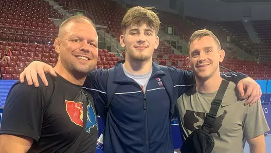 Jaxon Smith with Maryland coaches at 2022 U20 World Championships