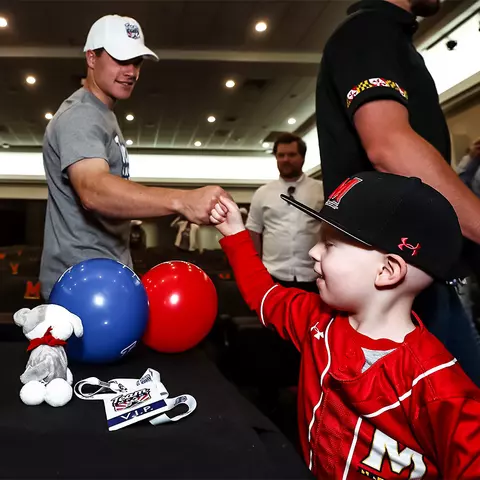 Brian McAllister fist bumps one of his new Terp teammates