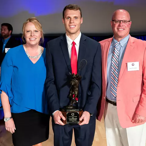 Logan Wisnauskas with his parents