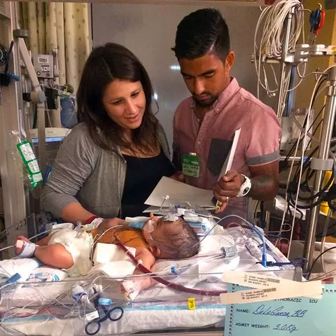 A.J. DeLaGarza and wife with Luca