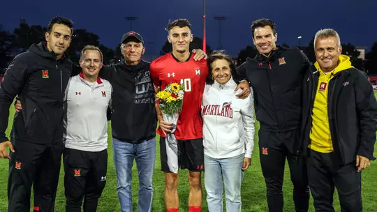 Stefan Copetti with his family and coaches on Senior Night