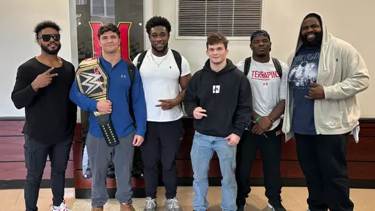 Maryland wrestlers with Maryland alum Ashante 'Thee' Adonis and Odyssey Jones