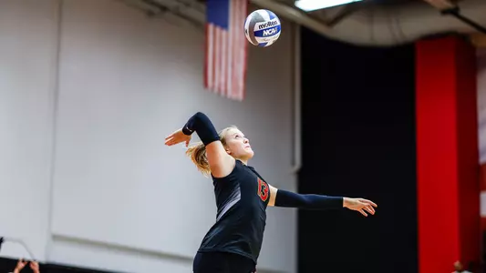 Erin Engel serves the ball against Coastal Carolina.