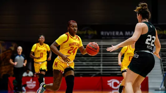 Bri McDaniel dribbles against Green Bay