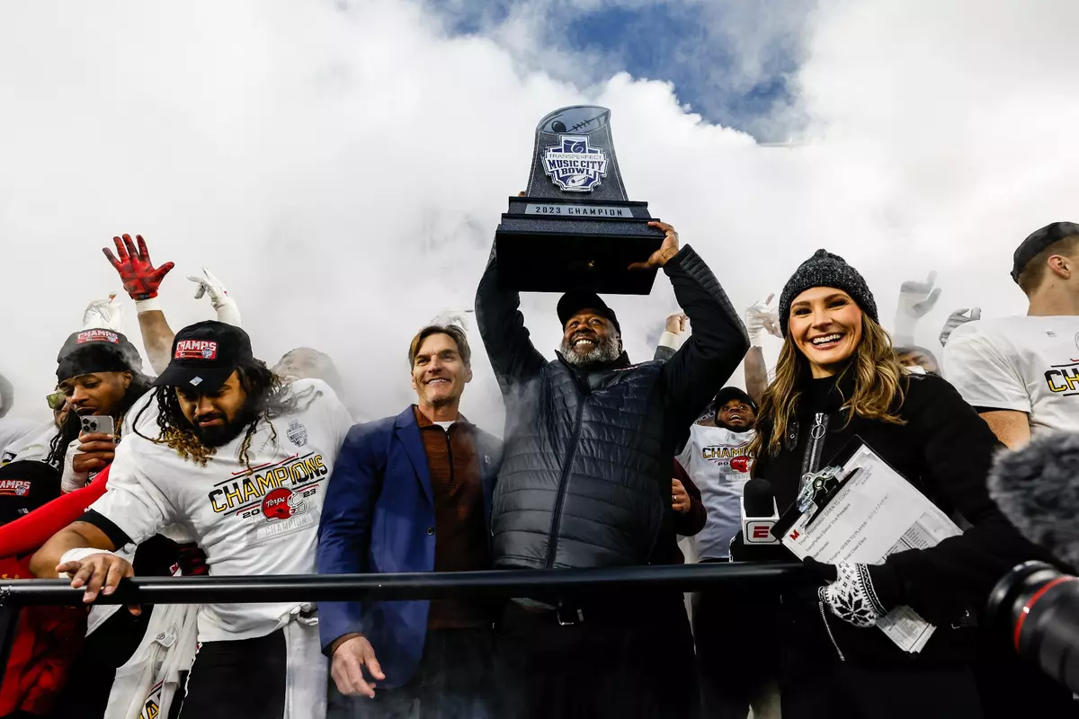Coach Michael Locksley Hoists Music City Bowl Trophy