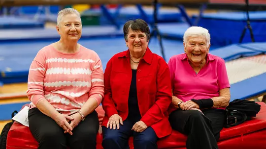 1974 team captain Marilyn Kostolich, first gymnastics coach Dr. Pat Danoff, and former women’s athletic director Dottie McKnight