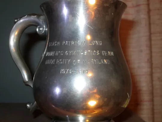 Commemorative cup given to first gymnastics head coach Dr. Pat Danhoff