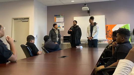 Men's Basketball student-athletes speaking to High Road School Students about importance of mental health, education, and support