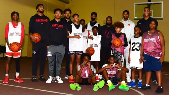 Men's Basketball student-athletes mentoring Church Youth Basketball Team