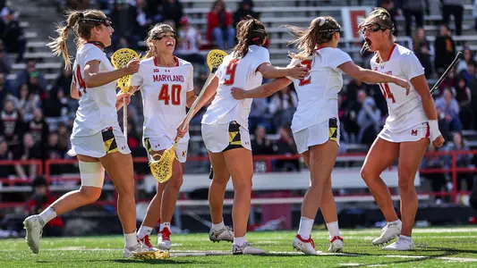 Kori Edmondson and the Terps celebrate a goal vs. Denver