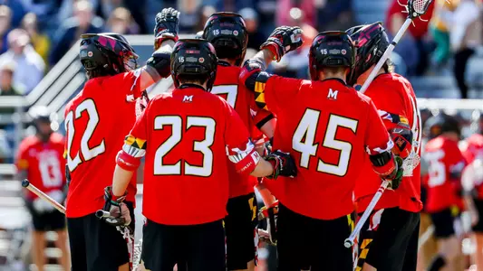 Men's Lacrosse huddle during Virginia game in 2023