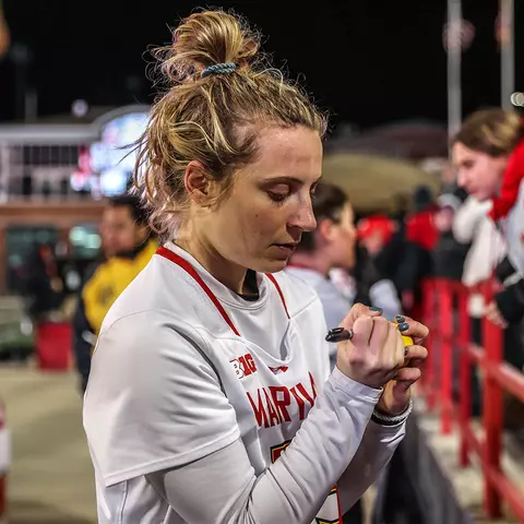 Emily Sterling signs an autograph after a Maryland women's lacrosse game