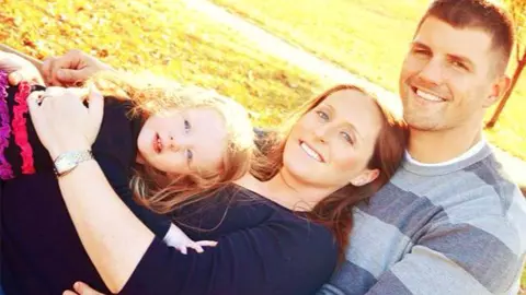 Andrew and Lindsay Crummey with their daughter