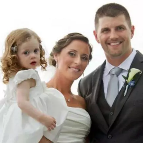 Andrew and Lindsay Crummey with their daughter