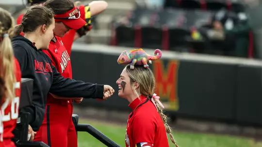 Maryland softball student-athletes having fun with one of the team's stuffed animals
