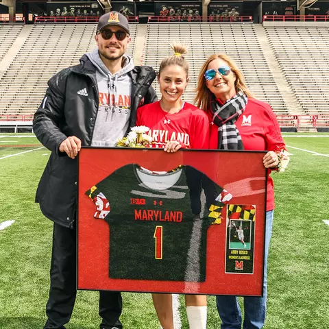 Abby Bosco with her brother and mother at Senior Day