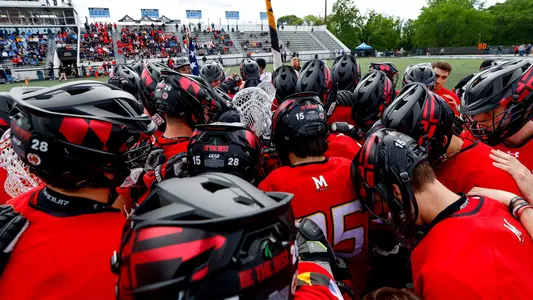 Men's Lacrosse team huddle prior to Johns Hopkins game in 2023 Big Ten Tournament Semifinals