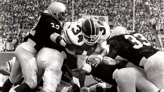 Willie Joyner jumps through the Penn State defense during a game, September 11, 1982