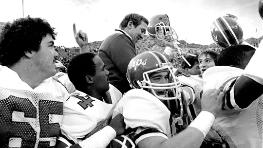 Bobby Ross being carried off the field by his players following the Sun Bowl
