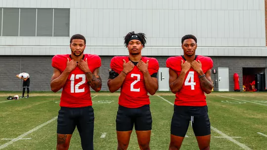 Dante Trader Jr., Beau Brade, and Tarheeb Still