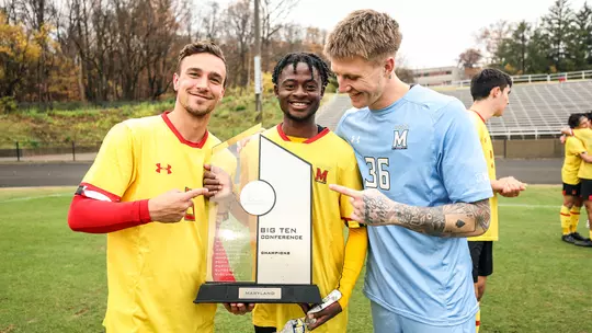 Alex Nitzl and teammates with the Big Ten trophy