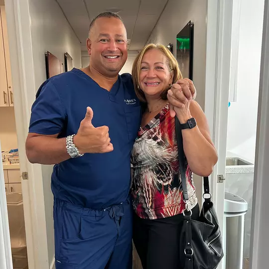 Dr. Jaime Flores with a patient