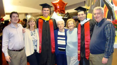 Patrick Mullins with family and friends at graduation