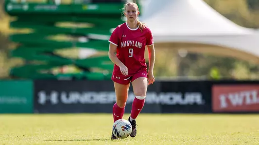 Katie Coyle Races Downfield with ball Against Nebraska