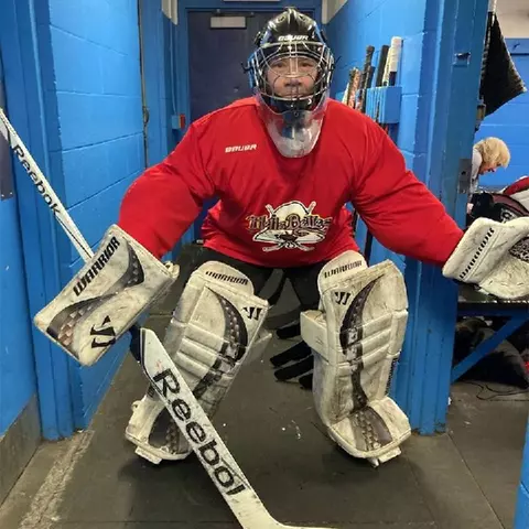 Kim Chorosiewski suiting up in goal for an ice hockey game