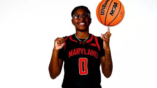Shyanne Sellers white backdrop black uniform
