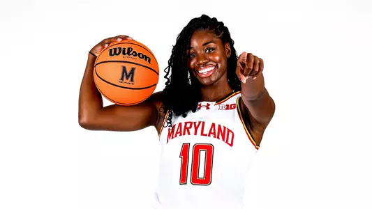 Mir McLean white uniform white backdrop