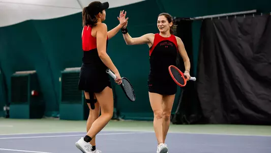 Maria Budin and Minorka Miranda High Five