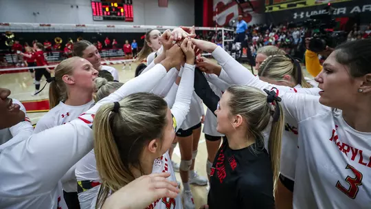 Terps huddle before volleyball match