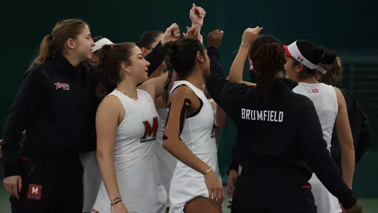 Team Huddle After Doubles Play Against Michigan