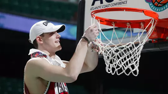 Nik Caner-Medley cutting down the net following the 2004 ACC Championship tournament win