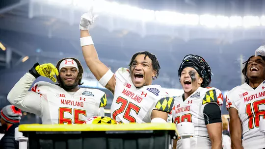 Beau Brade celebrates after the Terps' Pinstripe Bowl win in 2021
