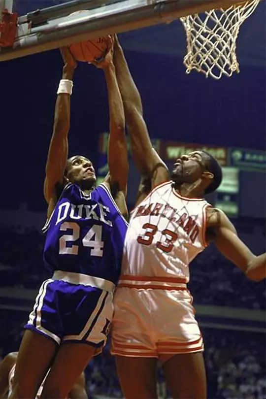 Derrick Lewis blocks Johnny Dawkins's shot