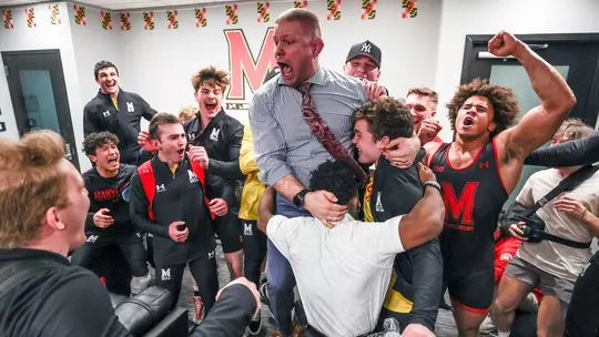 Alex Clemson celebrates with his team after toppling Purdue in 2022.