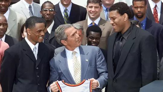 Juan Dixon and Lonny Baxter with President George W. Bush at the White House