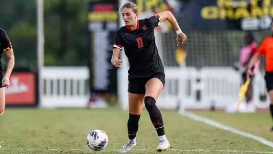 Emily Lenhard Races down sideline with Ball