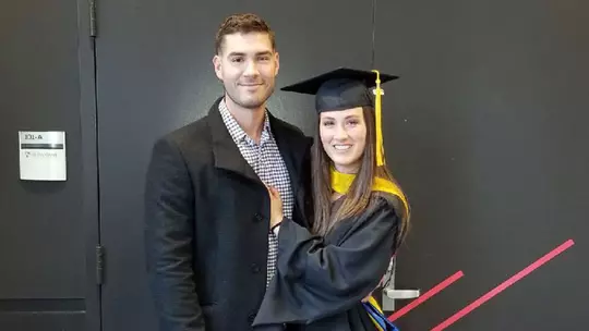 Danielle Ladd and her husband at her Master's graduation