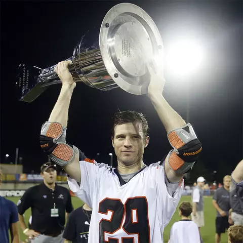 Lee Zink holding the Steinfield Trophy after the Denver Outlaws won the 2014 MLL Championship