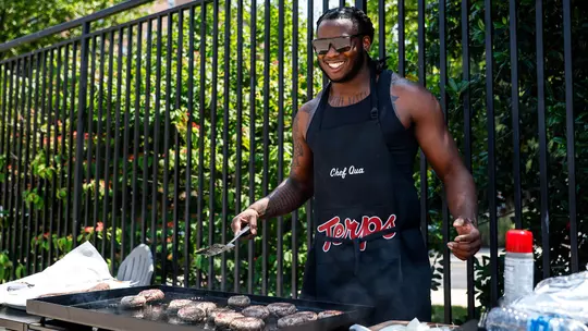 Quashon Fuller at the grill at the Terps Football Summer Pool Party