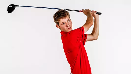 Florian Huerlimann swings club in posed shot